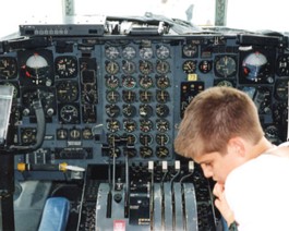 C130-Cockpit I thought the Air Force was going too far in their recruiting efforts...luckily this young 'un in a C-130 cockpit was only a visitor.